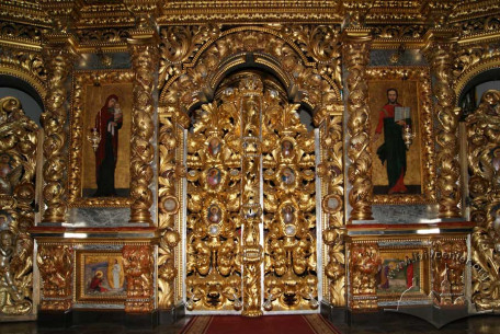 Vul. Khmelnytskoho, 36. The royal doors of the iconostasis with icons of Christ and Mary on their sides, and predellas below done by artist Modest Sosenko