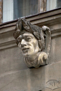 Vul. Halytska, 15. A stone male head under a window on 2nd floor