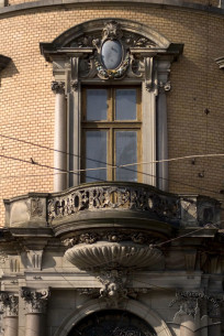 Prosp. Svobody, 15. A 2nd floor balcony above the main entrance (on the corner part of the building)