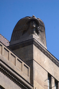 Vul. Kopernika, 4. Sculpture of Mercury at the attic above the main facade