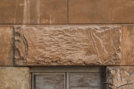Vul. Vyshenskoho, 16. Textured plasterwork above a window of the half-basement floor