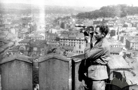 Military cinematographer V. I. Orliankin is filming from the top of Lviv City Hall tower, 1944.